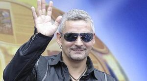 Former Italy striker Roberto Baggio waves to the crowds during a promotional event in Guangzhou