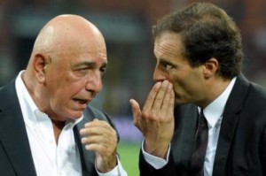 MILAN, ITALY - AUGUST 21:  AC Milan AD Adriano Galliani and head coach Massimiliano Allegri talk during the Berlusconi Trophy match between AC Milan and Juventus FC at Giuseppe Meazza Stadium on August 21, 2011 in Milan, Italy.  (Photo by Claudio Villa/Getty Images)