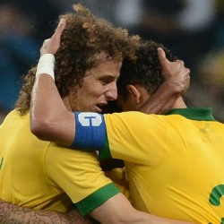 Brazil's defender David Luiz (L) and Brazil's defender and captain Thiago Silva react after a goal against France during the friendly football match at the Arena Gremio Stadium in Porto Alegre, Brazil, on June 9, 2013. Brazil won 3-0. AFP PHOTO / FRANCK FIFE        (Photo credit should read FRANCK FIFE/AFP/Getty Images)